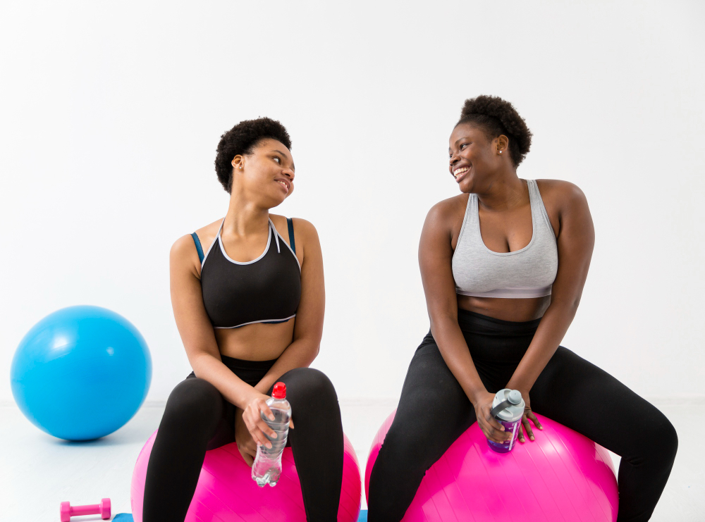 women-doing-exercises-fitness-ball (1)